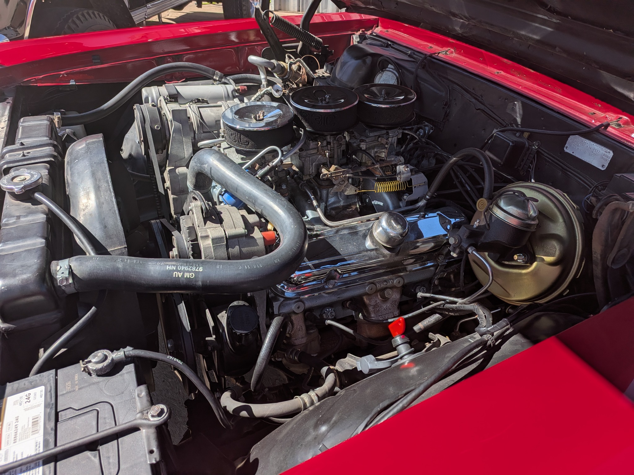 Detailed view of a restored classic V8 engine being serviced at Wizard's Automotive and RV
